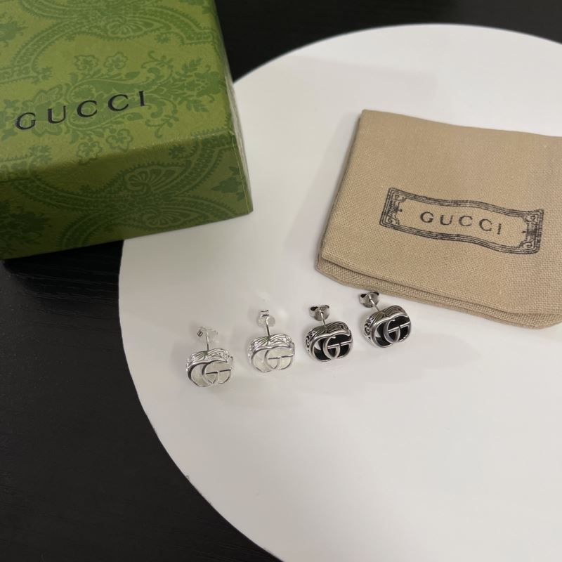 G*u*i earrings
